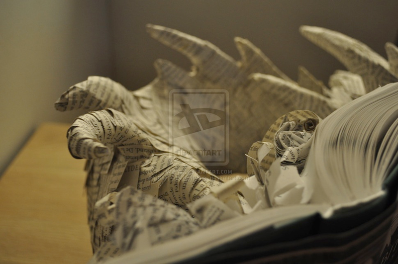 Illustration for article titled Artist Turns The Hobbit Book Into Paper Sculpture Of Smaug